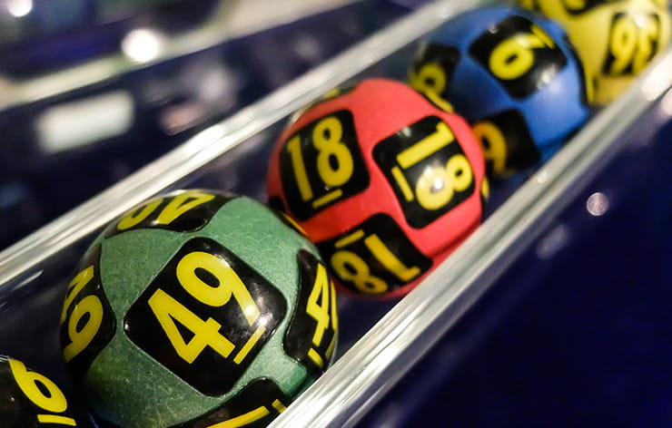 Green, red, blue, and yellow lottery balls.